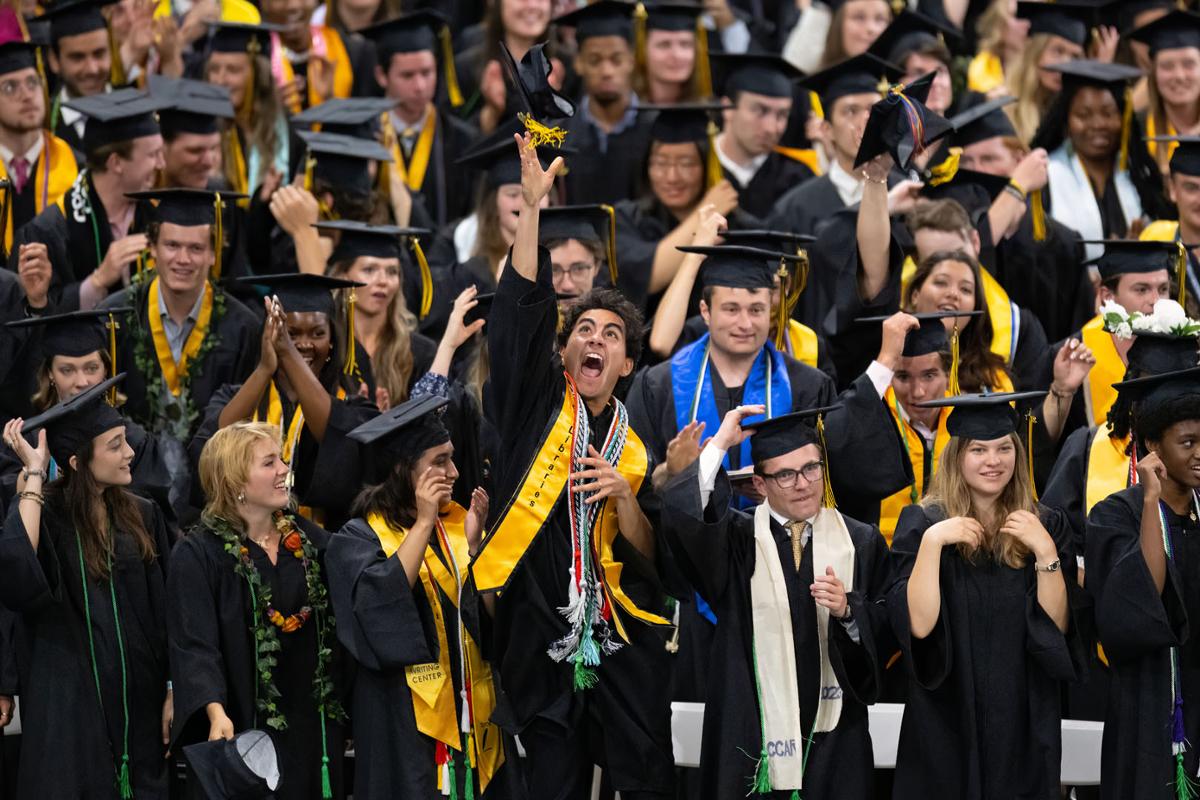 Students begin to celebrate at the close of Commencement Ceremonies for the Colorado College Class of 2023 Sunday, May 28, 2023 in Ed Robson Arena on the CC campus. Photo by Mark Reis